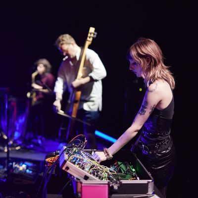 Electronic and produced music students on stage with guitar and sound desk